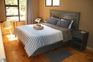 Postel nebo postele na pokoji v ubytování 46 Welgevonden in Dinokeng