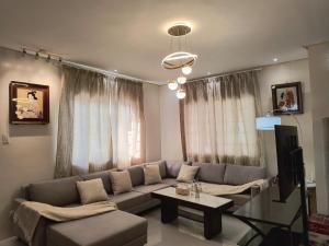 a living room with a couch and a table at Casathea Hometel Cebu in Talisay