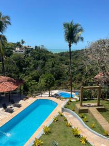 Swimmingpoolen hos eller tæt på Pousada Jardim das Bromélias + 45 billeder