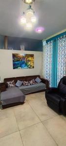 a living room with two couches and a couch at Casa San Ramón in San Ramón +1 photo