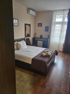 Ένα ή περισσότερα κρεβάτια σε δωμάτιο στο Къща за гости ДаРая