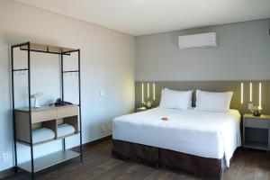 Postel nebo postele na pokoji v ubytování Pousada Vila Caminito