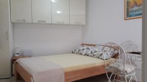 Postel nebo postele na pokoji v ubytování Apartment Ela