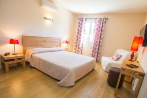Postel nebo postele na pokoji v ubytování Hotel Cesario