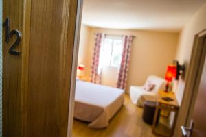 Postel nebo postele na pokoji v ubytování Hotel Cesario