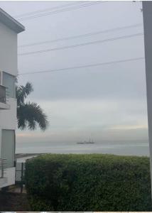 a view of the ocean from a house at The Manor in Ikoyi