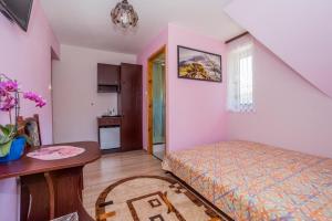 Posteľ alebo postele v izbe v ubytovaní Pokoje Apartamenty Pod Limbą
