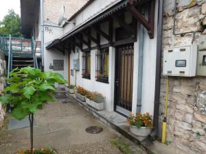 a building with flowers in front of a door at Apartment Sabina in Sarajevo