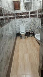 a bathroom with a toilet and a sink at Blue Door in Aswan