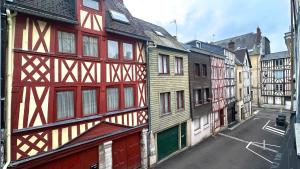 a group of wooden buildings in a city at Le Coignebert in Rouen