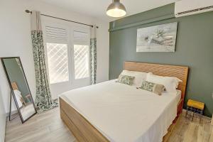 Postel nebo postele na pokoji v ubytování Appartement cosy avec vue sur mer