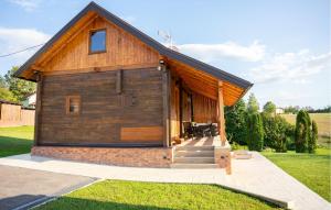 a small house with a gambrel roof at Awesome Home In Jamnica Pisarovinska With Sauna in Jamnica Pisarovinska +27 photos