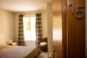 Postel nebo postele na pokoji v ubytování Hotel Cesario