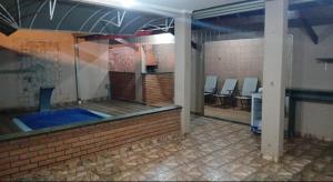an empty room with a gym with at Casa com área lazer in Ribeirão Preto +1 photo
