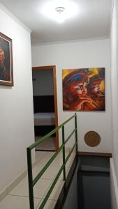 Postel nebo postele na pokoji v ubytování Casa de Gente Feliz