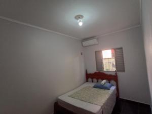 Ένα ή περισσότερα κρεβάτια σε δωμάτιο στο Casa de Gente Feliz