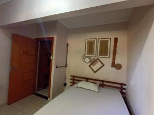 Ένα ή περισσότερα κρεβάτια σε δωμάτιο στο Casa de Gente Feliz