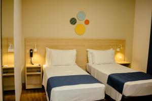 Postel nebo postele na pokoji v ubytování Luds Comfort Hotel + 74 fotografií