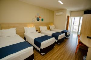 Postel nebo postele na pokoji v ubytování Luds Comfort Hotel