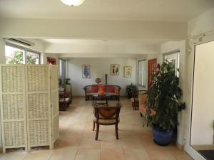 Posezení v ubytování L'Esperance Hotel