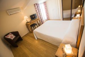 Postel nebo postele na pokoji v ubytování Hotel Cesario