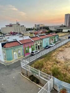 a row of colorful houses in a city at Comfortable apartment, excellent location in Maracaibo