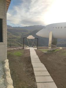 a view of the nose of an airplane at Lostin clouds in Yenokavan
