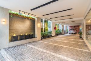a lobby of a hotel with a reception desk at Hotel Lenexa by Bestinn Leisure in Bengaluru