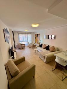 a living room with two couches and a table at Sil&Sol in Arona