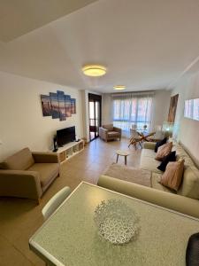 a living room with a couch and a table at Sil&Sol in Arona +18 photos