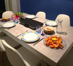 a table with plates of food on top of it at Villa Ibisa in Angles