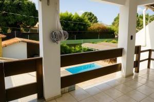 a view from the balcony of a house with a swimming pool at Pousada Jardins in São Luís
