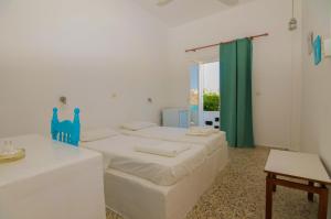 Voodi või voodid majutusasutuse Ios Plage toas