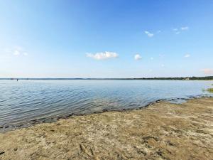 a view of the shore of a body of water at 4 person holiday home in Jægerspris in Jægerspris