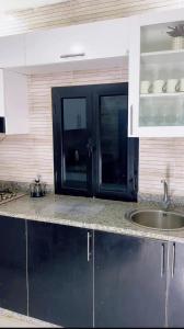 Kuchyň nebo kuchyňský kout v ubytování Modern Stay