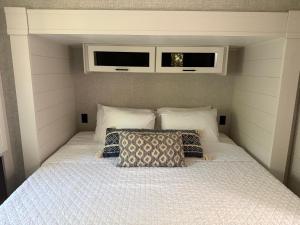 a bed with two pillows in a bedroom at Beachfront Retreat w Pool, Boat Ramp & Dock Rental in Key Largo +27 photos