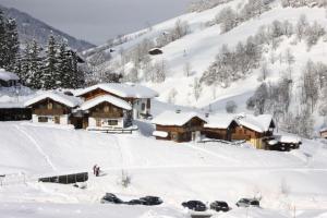 a ski lodge in the snow on a mountain at Stallerhütte in Bachwinkl