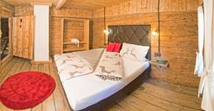 Ένα ή περισσότερα κρεβάτια σε δωμάτιο στο Bergchalet Heidialm +6 φωτογραφίες