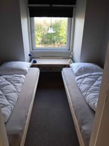 Postel nebo postele na pokoji v ubytování Lille Hus På Landet
