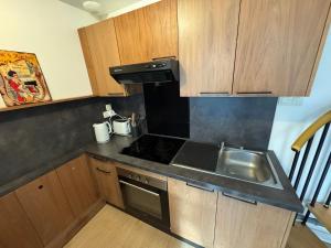 Η κουζίνα ή μικρή κουζίνα στο Appartement lumineux et moderne proche gare