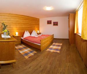 a bedroom with a bed in a room at Schmaranzhütte in Grossarl