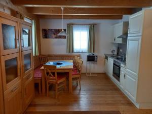 Kuchyň nebo kuchyňský kout v ubytování Hüttendorf Flattnitz - Typ B