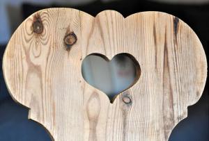 a wooden box with a heart cut into it at Bergchalet Klausner Edelweiß in Ramsberg