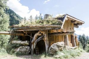a log cabin with grass on the roof at Chalet Wildberg in Unterberg
