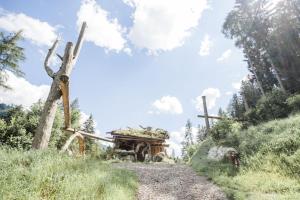 a truck on a dirt road in a field at Chalet Wildberg in Unterberg