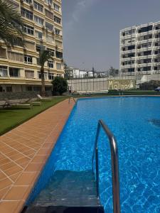 a large swimming pool in front of a building at Mividacanaria in San Bartolomé de Tirajana