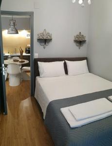 Postel nebo postele na pokoji v ubytování Portatif Apartments