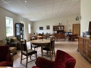 a dining room with a table and chairs at Studlagil INN Hostel in Skjöldólfsstaðir