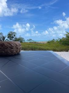 a close up of the roof of a tent with a field at Flat Mirante da praia - piscinas naturais PE-AL in São José da Coroa Grande