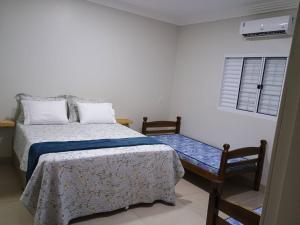 Postel nebo postele na pokoji v ubytování Pousada Zero Três - 03